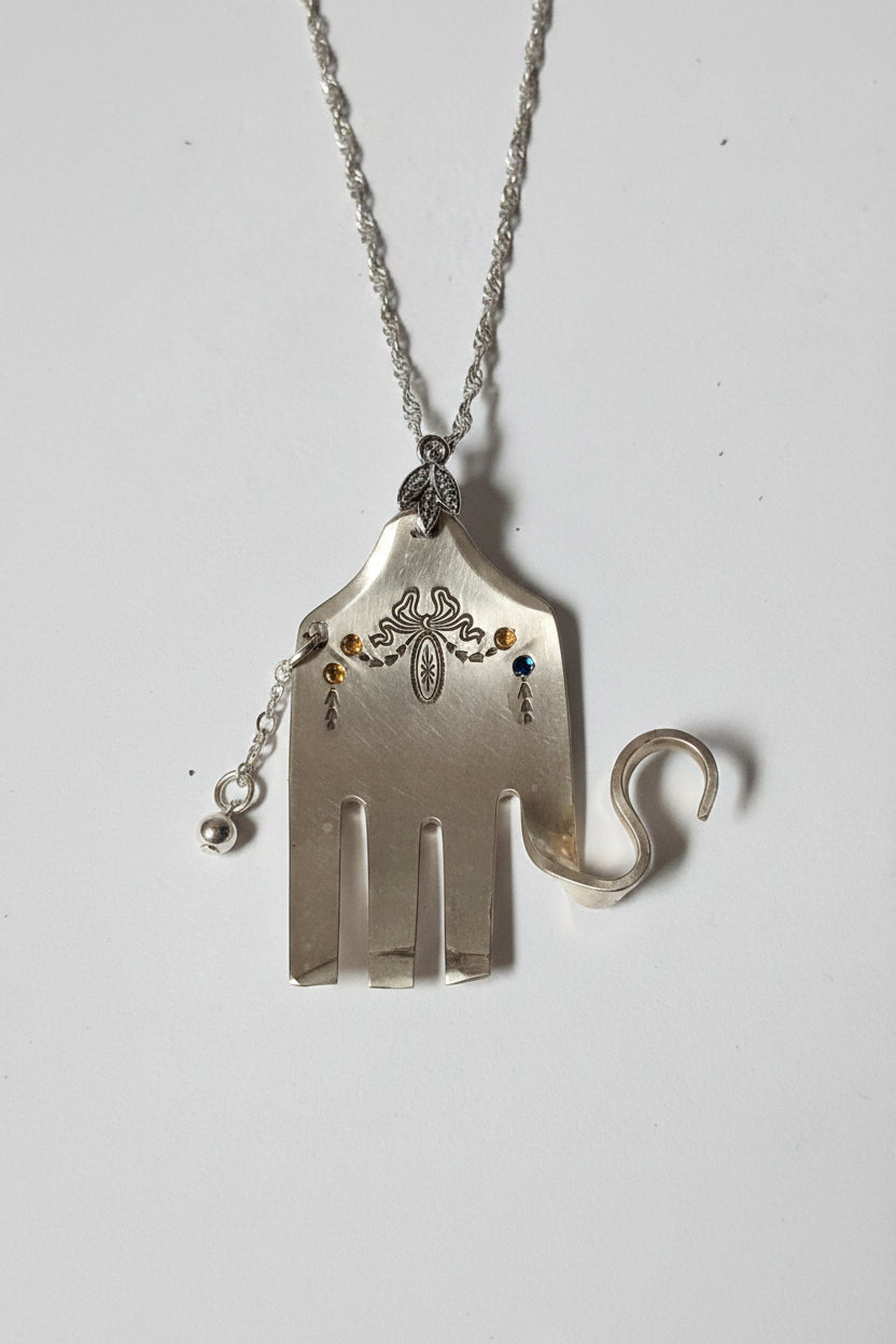 Handcrafted silver elephant pendant made from vintage silverware. Symbolizes strength, wisdom & luck. Eco-friendly, one-of-a-kind, and artisan-made in the USA. Mmade from vintage silverware. Symbolizes strength, wisdom & luck. Eco-friendly, one-of-a-kind, and artisan-made in the USA.