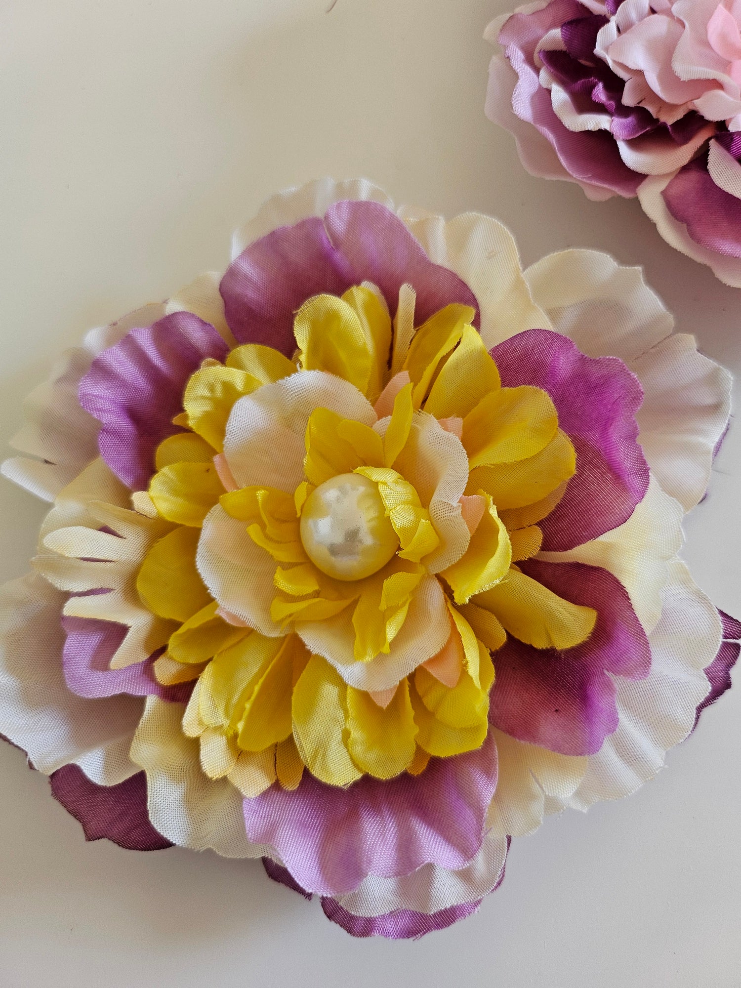 Handmade beaded flower clips for hair, bags, dresses and more. Colorful, fun, and one-of-a-kind—Spring Lemonade Foo Foo Flowers add flair anywhere you wear them!
