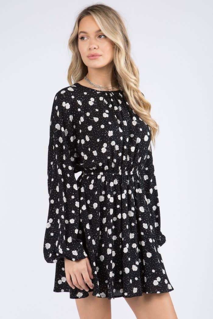 Starry Blossom Woven Dress with long sleeves, elastic waist & floral print. A chic black mini perfect for day-to-night style. Lined & lightweight.