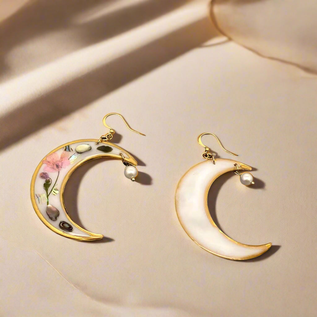 Lunar Bloom earrings with real pressed flowers in resin and 18K gold-plated brass. Bold, handmade floral statement jewelry in a 40mm x 66mm drop design.