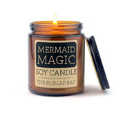 Mystical Mermaid: A sea salt & driftwood scented soy candle in a 9oz amber jar. Beachy, ocean-inspired, hand-poured in Austin for 50+ hours of magic.