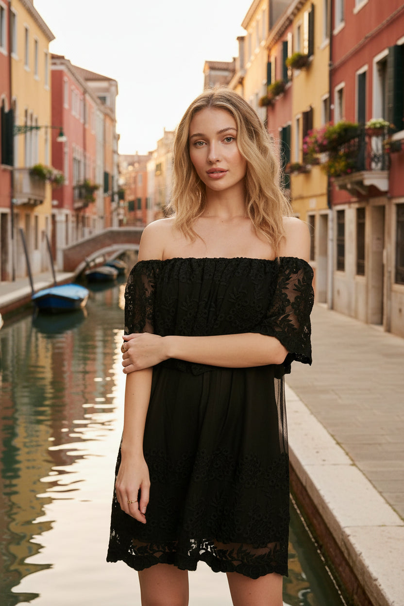 Off-the-shoulder floral lace mini dress with elastic neckline and swingy flounce silhouette. Romantic woven lace, scalloped hem, feminine fit.
