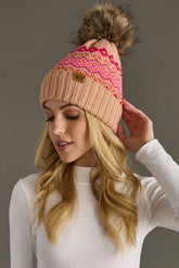 Blush, pink & orange patterned knit hat with natural faux fur pom. Fleece lined for extra warmth & pairs perfectly with matching mittens. 100% acrylic.
