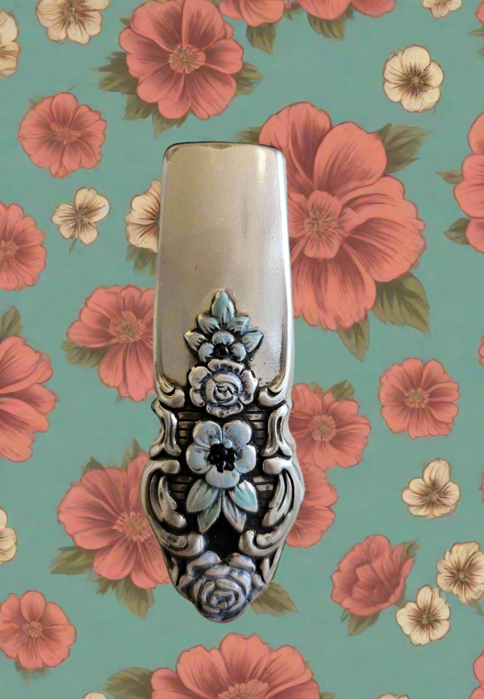 Whimsical bud vases crafted from vintage silverware with magnetic backs—perfect for single blooms and small clippings. Each one is a one-of-a-kind treasure.