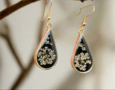 Dark Botanica earrings showcase real Queen Anne’s Lace in black resin teardrop earrings with gold-plated frames—bold, elegant earrings that are naturally one-of-a-kind.
