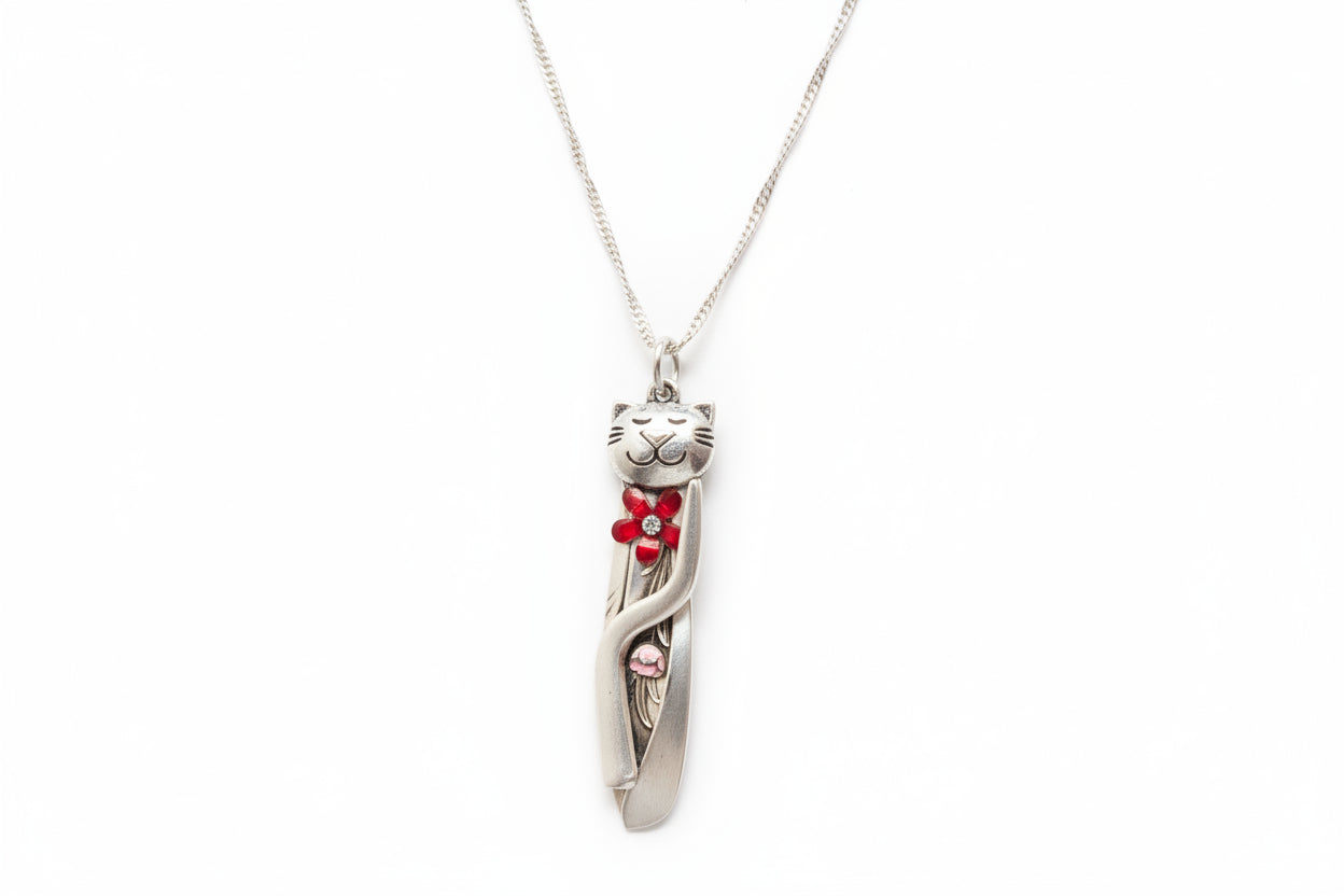 Handmade silver cat pendant necklaces from vintage silverware. Elegant, whimsical, and adjustable on a satin cord. Sustainably crafted and one-of-a-kind.