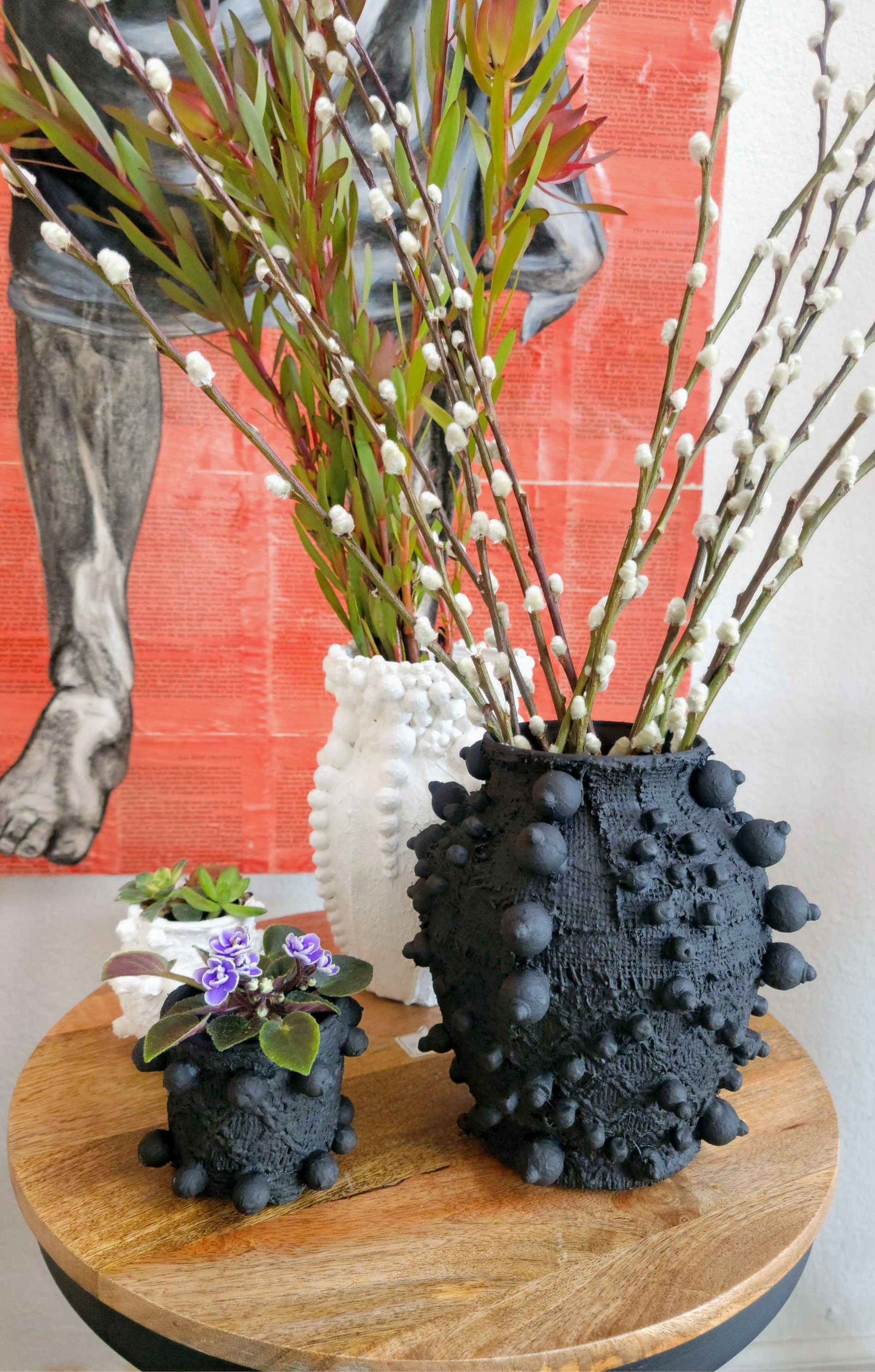 Elevate your home decor with this one-of-a-kind upcycled, handcrafted Small Planter. Made from reclaimed materials, each piece features a unique textured finish and comes in 4 finishes: Black, White, Sand, and Light Pink. Available with or without a plant, it&