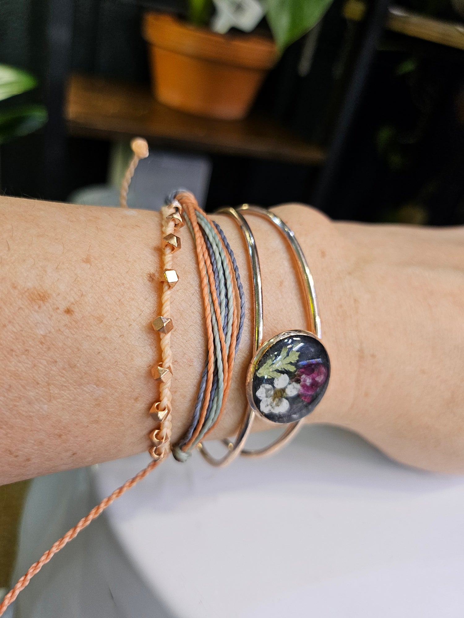 Handcrafted floral resin bracelets with real dried flowers. Unique, nature-inspired jewelry that adds whimsical charm and elegance to any outfit.