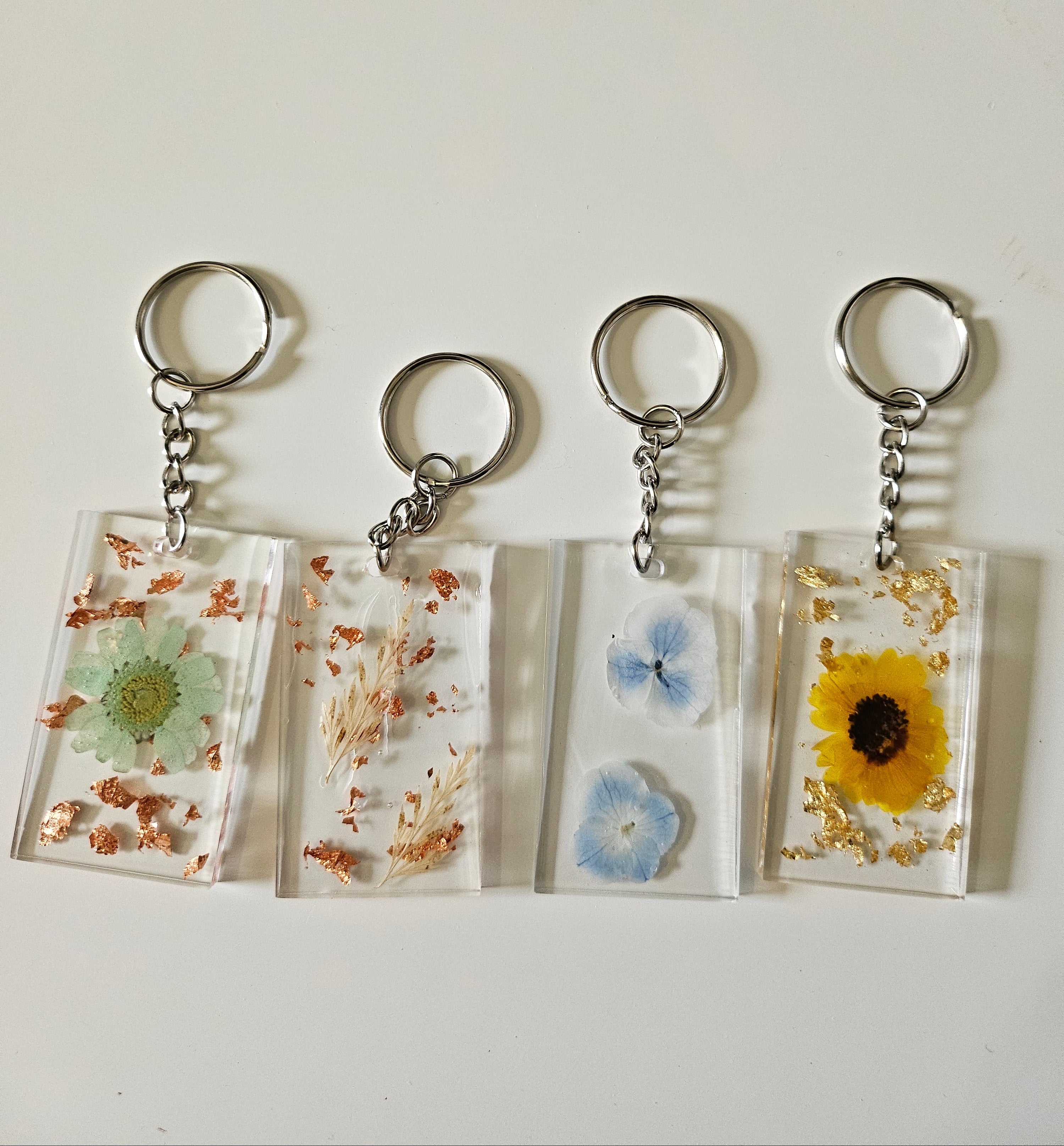 These Resin Pressed Flowers Keychains are handcrafted with real dried flowers suspended in crystal-clear resin.
