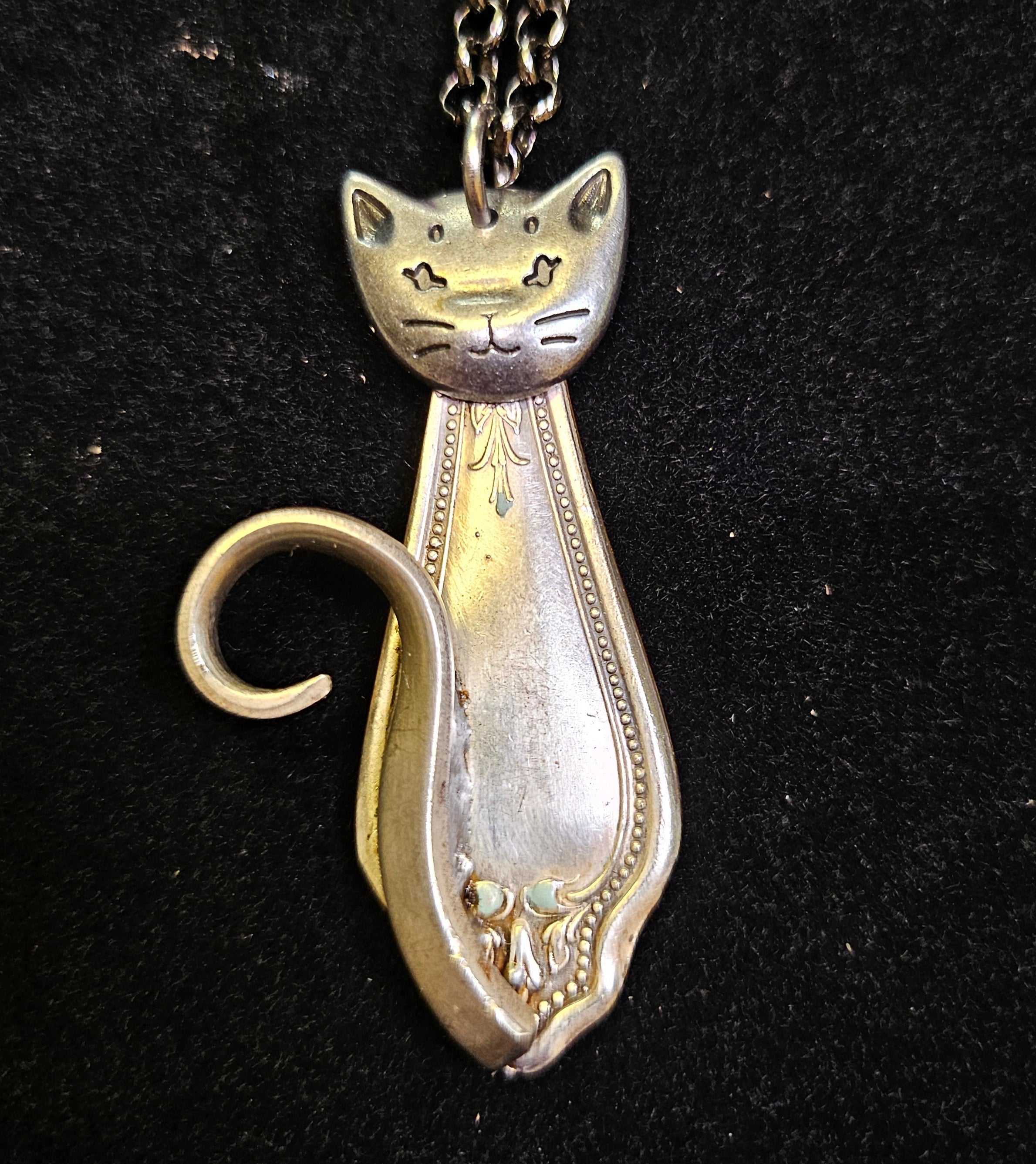 Handmade silver sassy cat pendant necklaces from vintage silverware. Elegant, whimsical, and adjustable on a satin cord. Sustainably crafted and one-of-a-kind.