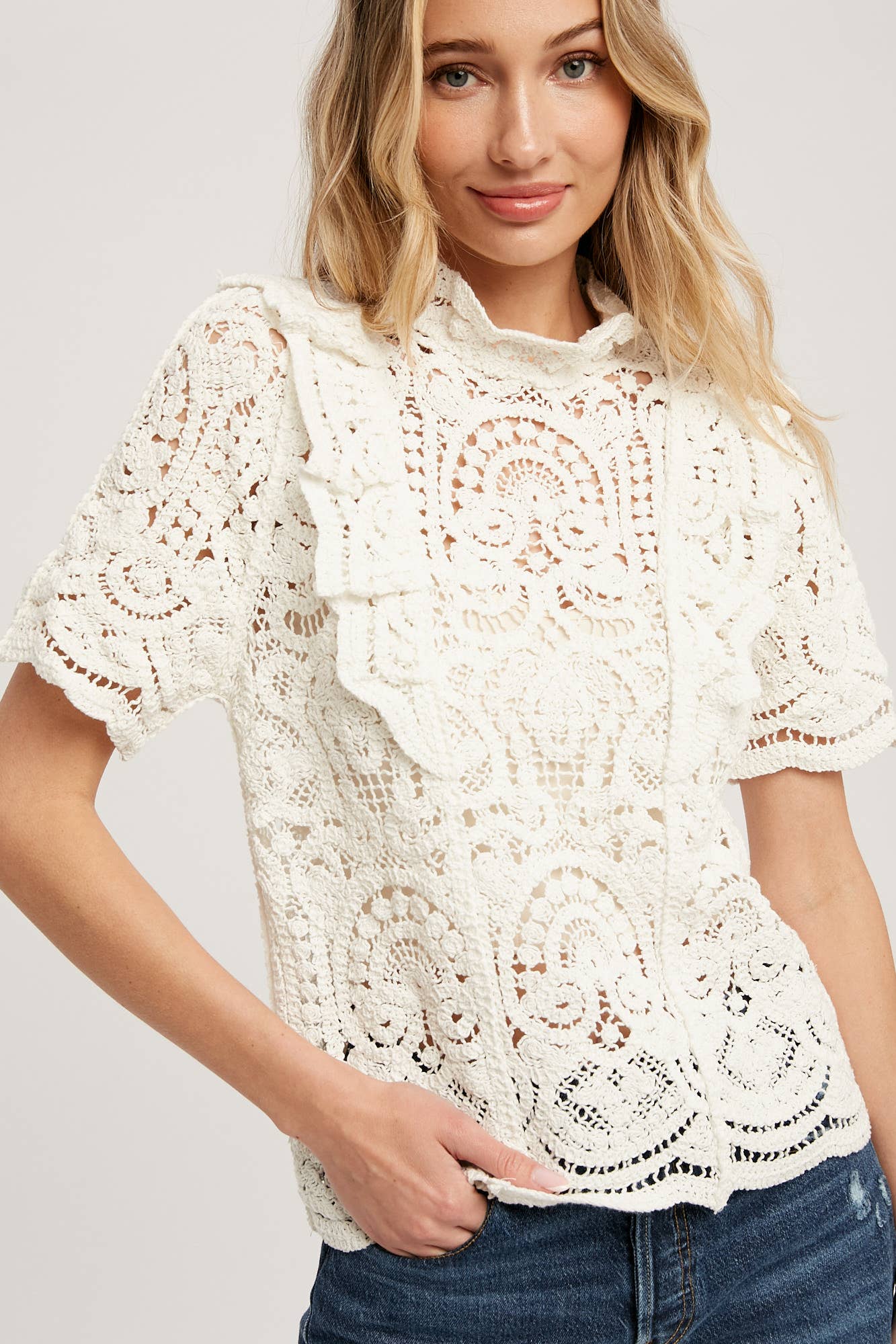 Romantic crochet lace top with frills, scalloped edges, and a relaxed fit. Perfect for layering over camis or dresses. A dreamy, vintage-inspired staple.