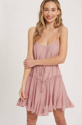Lightweight cami swing dress with scoop neck, adjustable straps, ruffled hem & tie waist. A flirty, flowy summer must-have in 3 dreamy color options.