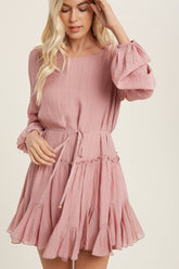 A flirty mini swing dress with balloon sleeves, ruffle trim, and adjustable waist. Lightweight, breathable, and perfect for everyday whimsy.