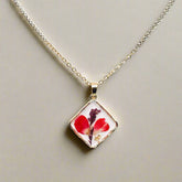 Handcrafted square pendant necklace with real pressed dried flowers in clear resin. Unique botanical jewelry with stainless steel chain and copper frame.