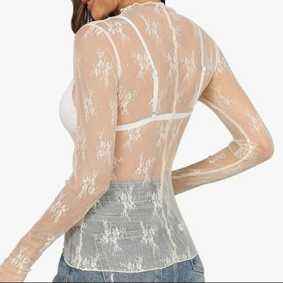 Elegant sheer mesh lace top with floral embroidery, mock neck & thumbhole sleeves. Perfect for layering or nights out. Romantic & versatile style.