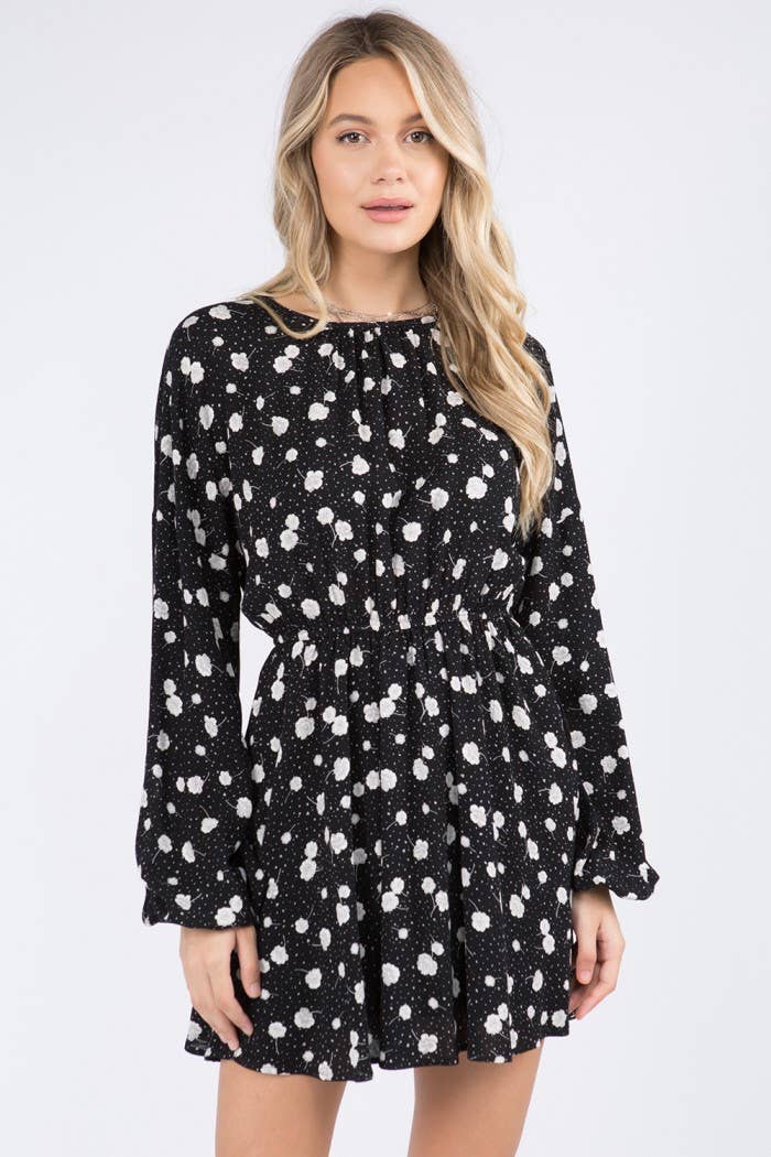 Starry Blossom Woven Dress with long sleeves, elastic waist & floral print. A chic black mini perfect for day-to-night style. Lined & lightweight.