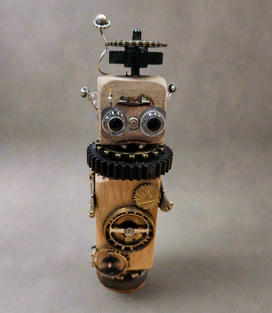 The Handmade Wood Block Steampunk Robot is a unique, decorative figurine crafted from wood with an aged, rustic look. Each robot is one-of-a-kind for display only. Includes a heart-shaped balloon. Available in various sizes, it&