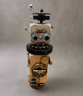The Handmade Wood Block Steampunk Robot is a unique, decorative figurine crafted from wood with an aged, rustic look. Each robot is one-of-a-kind for display only. Includes a heart-shaped balloon. Available in various sizes, it&