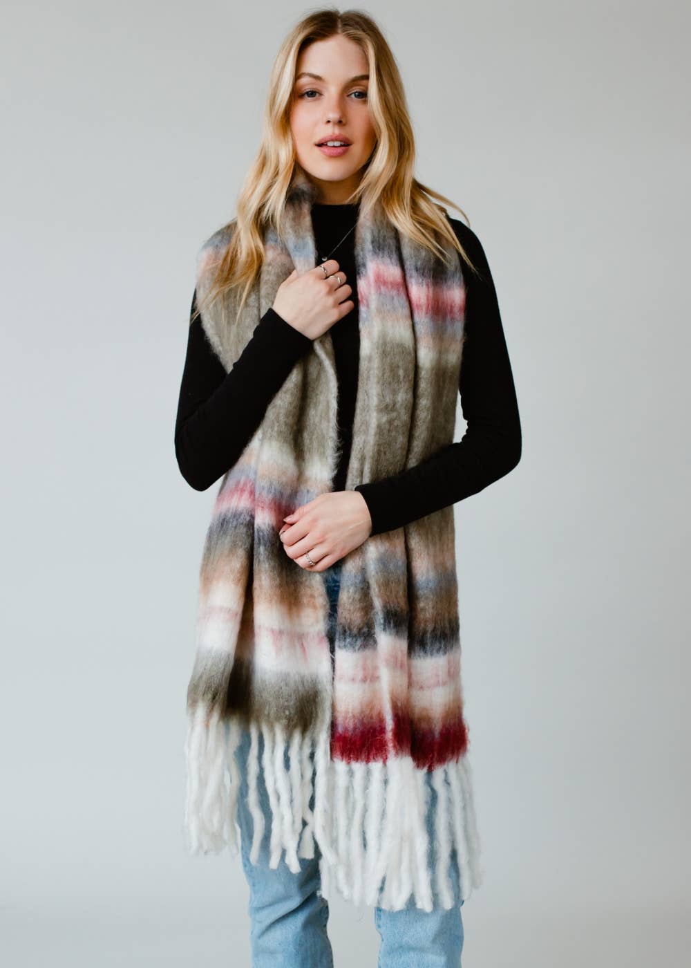 Striped fringe scarf in olive, beige, pink, and maroon. Soft acrylic blend, 12" x 72", cozy, stylish, and versatile for layering in any season.