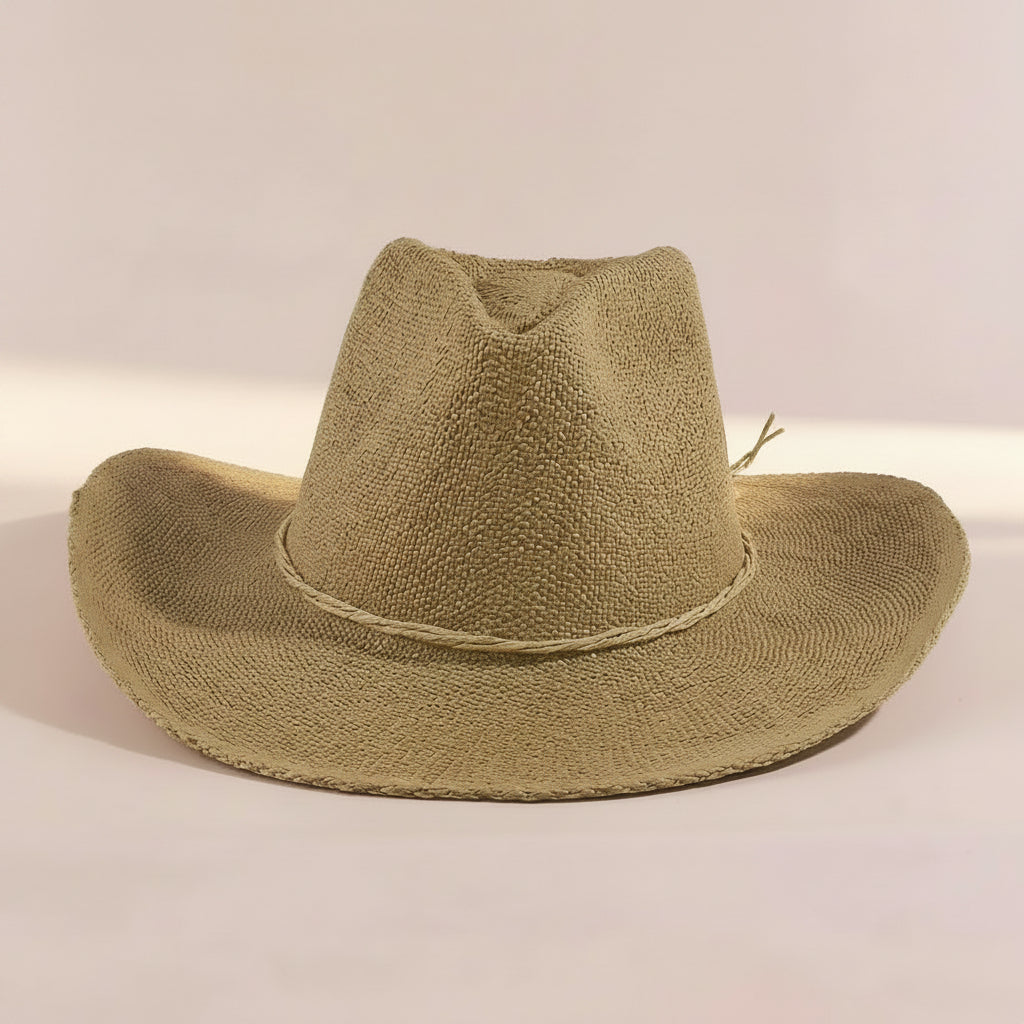 Braided cord band cowboy hat featuring woven paper straw texture and soft curved brim. Lightweight boho western style perfect for beach days, festivals, and summer outfits.