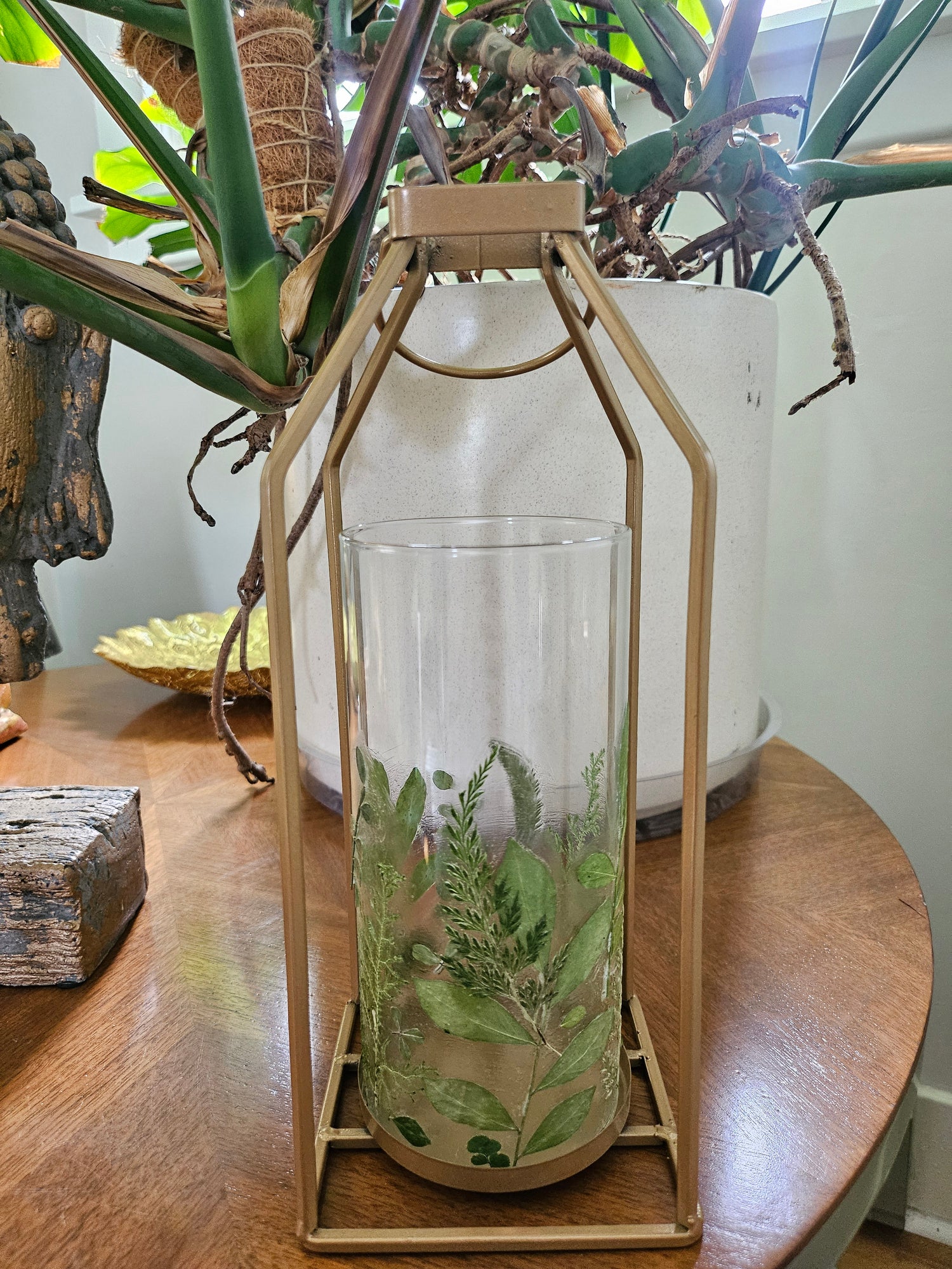 Verdant Canopy Gold Lantern features real pressed ferns and greenery in a gold frame, bringing forest charm and calming light to any indoor or outdoor space.
