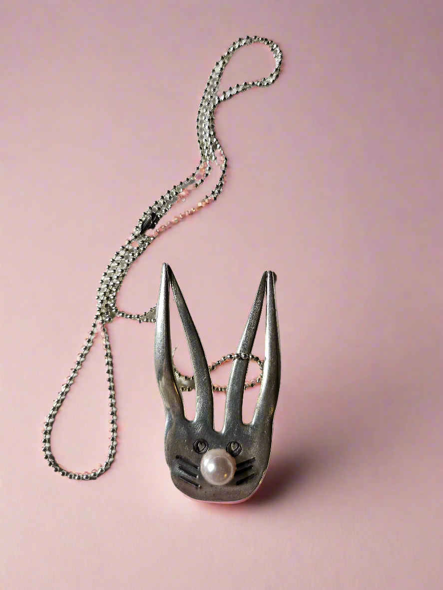 The Salvaged Silver Bunny Pendant is a handcrafted, one-of-a-kind piece made from recycled vintage silverware. Designed by artisan KStonely, it blends whimsical Easter charm with sustainable craftsmanship. Lightweight and unique, it’s perfect for everyday wear or special occasions. A timeless, upcycled treasure that celebrates history and artistry.