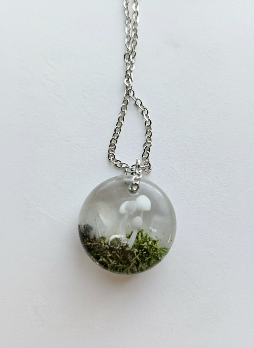 Gathered-in-the-Wild Botanical Necklace with real foraged flowers, mushrooms, pine needles, and leaves preserved in resin. Handcrafted wearable nature art by KStonely.