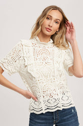 Romantic crochet lace top with frills, scalloped edges, and a relaxed fit. Perfect for layering over camis or dresses. A dreamy, vintage-inspired staple.