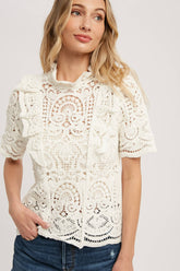 Romantic crochet lace top with frills, scalloped edges, and a relaxed fit. Perfect for layering over camis or dresses. A dreamy, vintage-inspired staple.