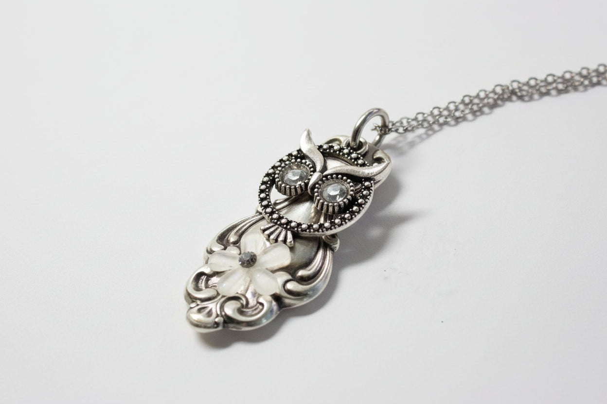 Handcrafted owl necklace made from vintage silverware. 1" pendant on 18" chain. Unique, upcycled jewelry with charm, symbolism, and timeless style.