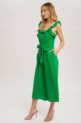 Chic textured cotton jumpsuit with frill trim, wide-leg fit, side pockets, self-tie waist, and back zipper. A relaxed, flattering one-piece for any season.