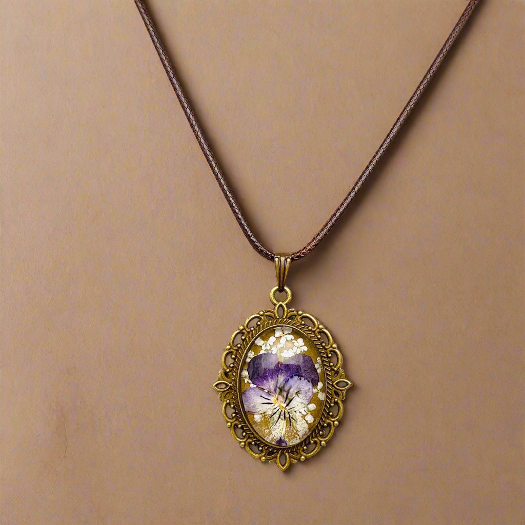Palace Bloom Vintage Floral Necklace with real dried flowers in resin, antique-style pendant, and waxed rope chain. Lightweight, elegant, and one-of-a-kind.