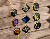 Wildflower Whisper Bracelet with real pressed flowers in resin and adjustable stainless-steel chain. Unique, hypoallergenic, and perfect for everyday nature lovers.