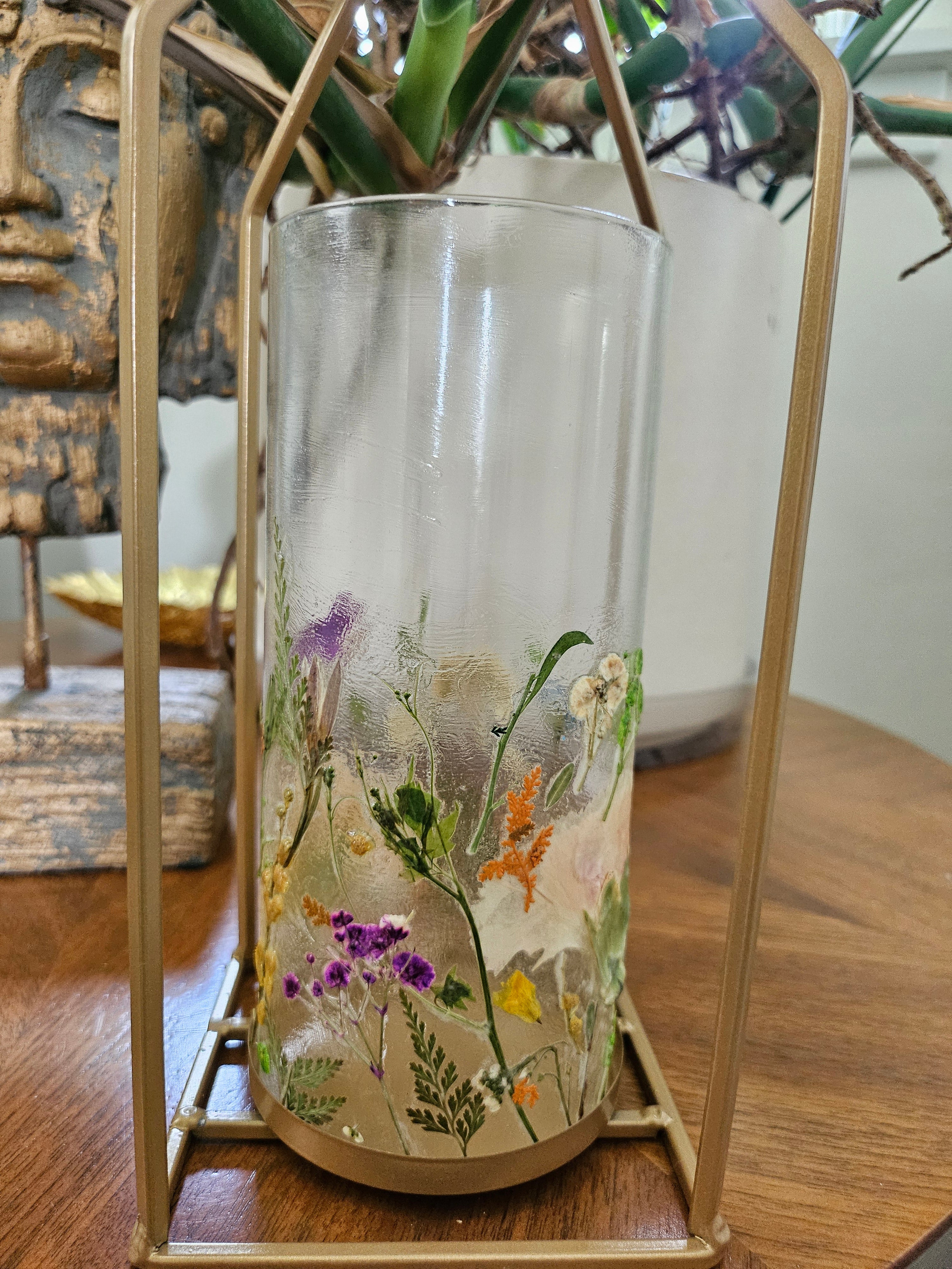 Wildflower candle lantern with real pressed flowers and gold lantern frame. A dreamy botanical accent for garden weddings, decor, and cozy, cottagecore spaces.