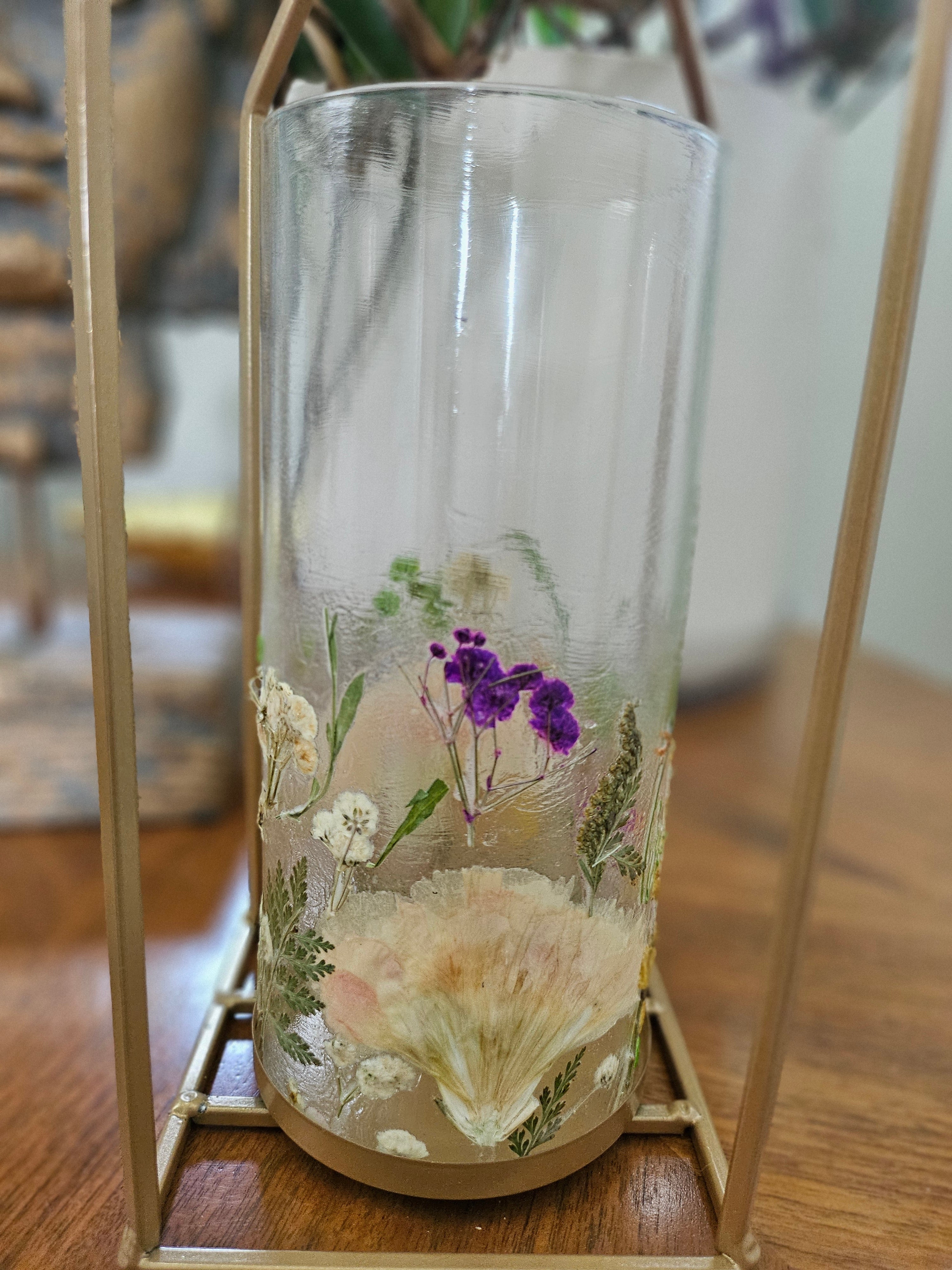 Wildflower candle lantern with real pressed flowers and gold lantern frame. A dreamy botanical accent for garden weddings, decor, and cozy, cottagecore spaces.