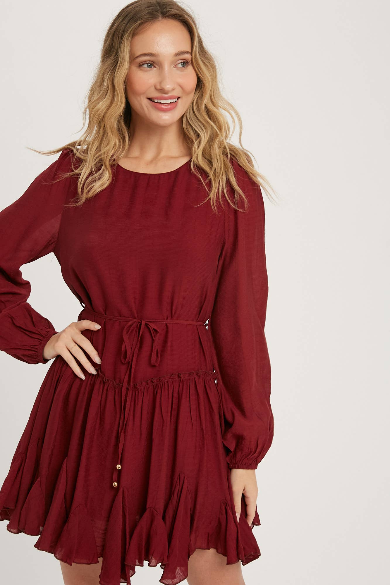 A flirty mini swing dress with balloon sleeves, ruffle trim, and adjustable waist. Lightweight, breathable, and perfect for everyday whimsy.