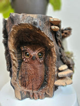 This Hand-Carved Owl & Mushroom Wood Spirit Planter in solid walnut features intricate carved owl and pinecone mushroom details. 100% handmade, each piece is unique and perfect for home decor or garden. The natural walnut grain and artisanal craftsmanship add rustic charm, making it a standout decorative piece for any space.