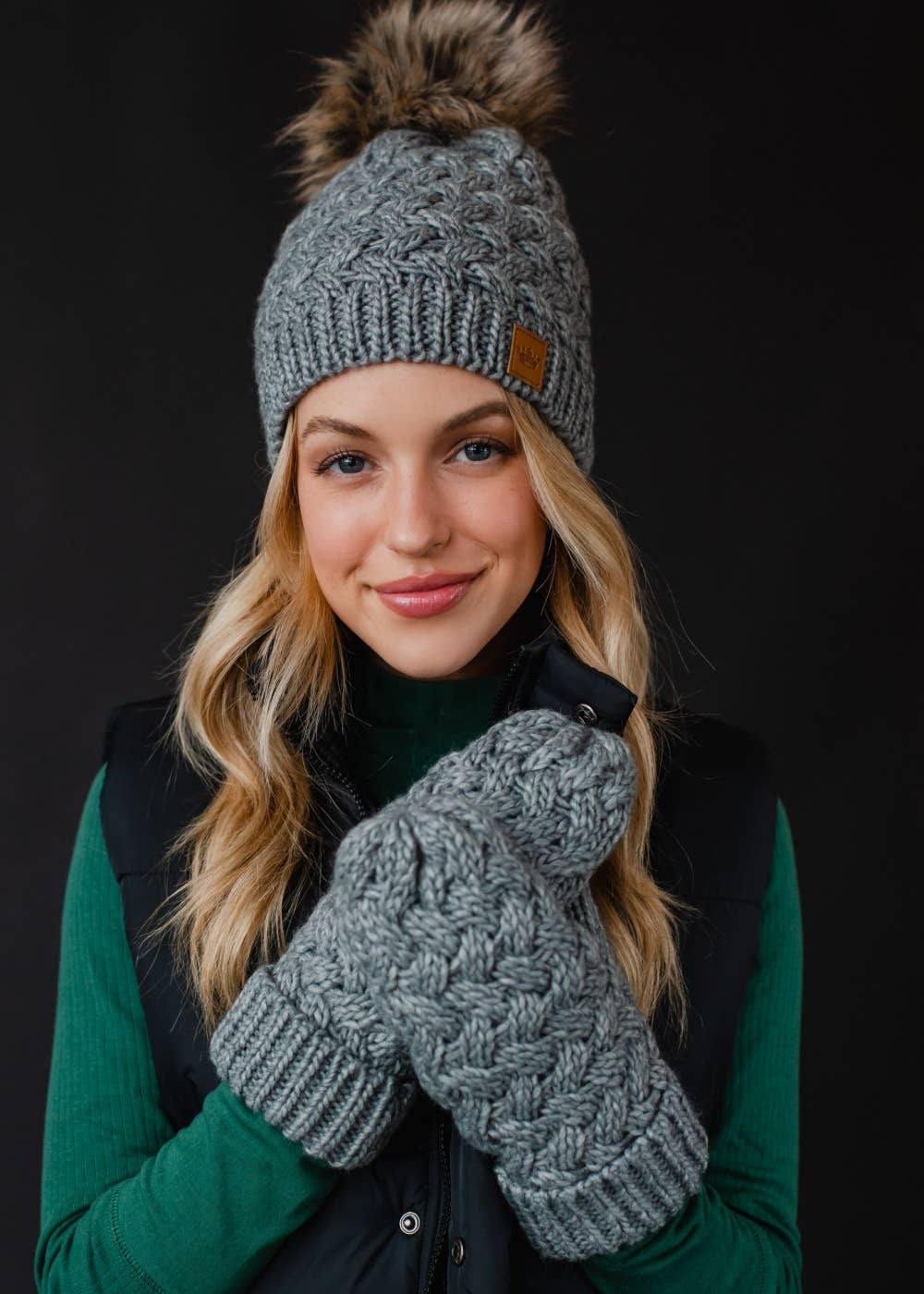 Gray knit mittens with cozy fleece lining. Made from 100% acrylic for warmth and durability. A classic winter essential for everyday cold-weather comfort.