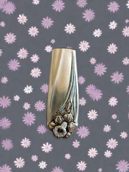 Whimsical bud vases crafted from vintage silverware with magnetic backs—perfect for single blooms and small clippings. Each one is a one-of-a-kind treasure.
