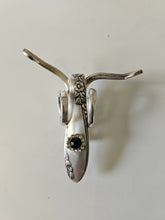 The Jeweled Lucky Fork Cricket is a whimsical, handcrafted sculpture made from repurposed vintage silverware. Each unique piece, shaped from antique forks, captures the charm of crickets—symbols of luck, prosperity, and protection. Adorned with jewels and aged patina, these one-of-a-kind collectibles add artistry, history, and positive energy to any space. 