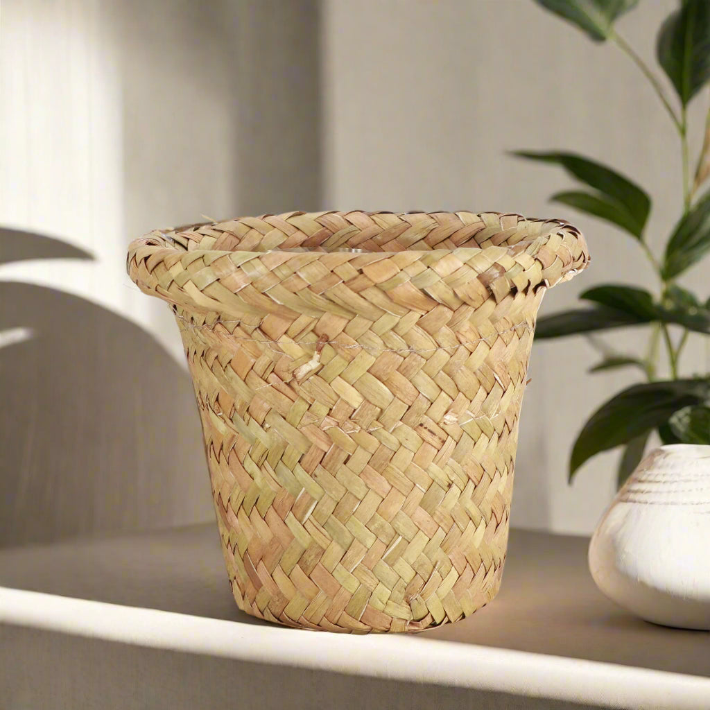Natural woven pot cover with plastic lining fits 4–4.5&quot; plants. Stylish, earthy cache pot with 2 shade options—perfect for boho or modern décor.