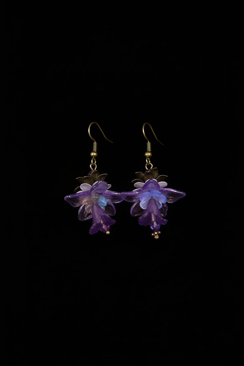 Hand-beaded Poison Garden earrings inspired by foxglove, wolfsbane, belladonna, datura, henbane and lily of the valley. Beautifully deadly botanical jewelry.