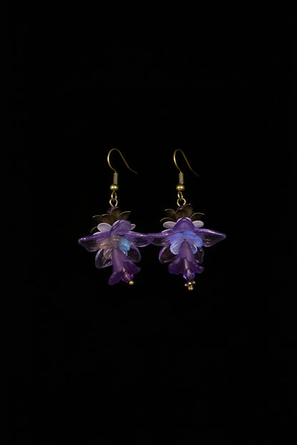 Hand-beaded Poison Garden earrings inspired by foxglove, wolfsbane, belladonna, datura, henbane and lily of the valley. Beautifully deadly botanical jewelry.