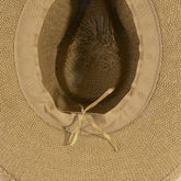 Braided cord band cowboy hat featuring woven paper straw texture and soft curved brim. Lightweight boho western style perfect for beach days, festivals, and summer outfits.