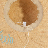Woven raffia sun hat featuring lightweight breathable texture and timeless summer style. Perfect for beach days, vacations, casual outfits, and warm-weat