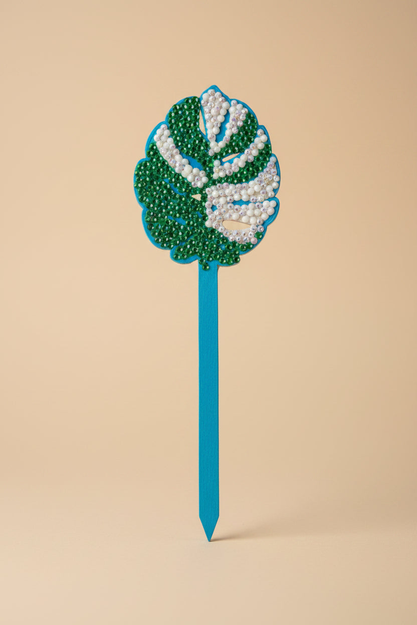 Bedazzled Monstera wooden plant stakes, hand-painted with sparkling details. Choose Monstera, Albo, Aurea or Thai Constellation for unique plant décor.