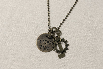 Steampunk pendants with gears, chains, tags, beads, and airship-inspired designs. Handcrafted, unique mixed-media necklaces perfect for cosplay, gifting, and fans of steampunk.