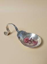 Handcrafted vintage silverware ladle trinket holder with resin and dried flowers. Perfect for rings, jewelry, and décor. Whimsical, cottagecore, one-of-a-kind.
