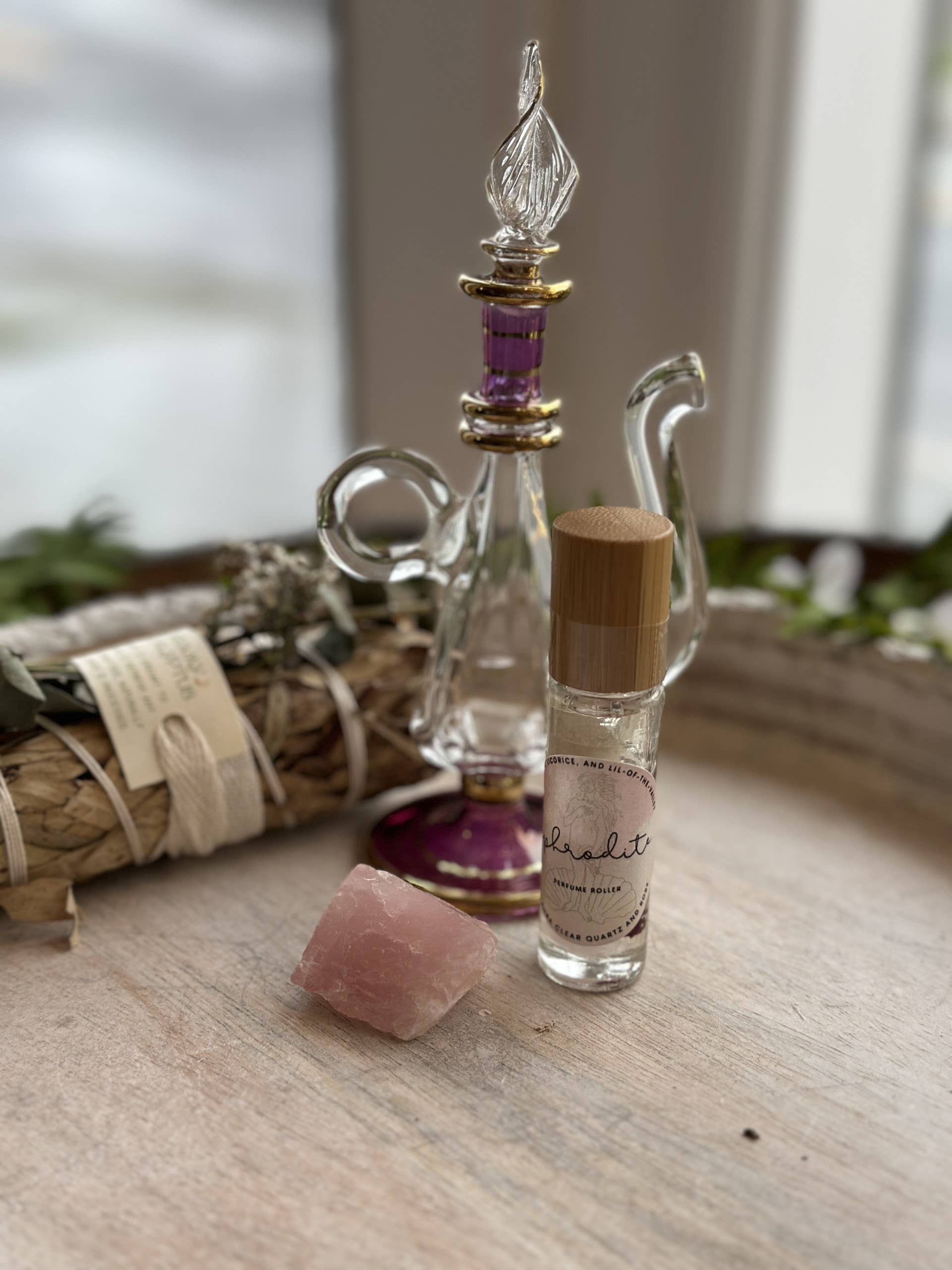 Aphrodite Goddess Perfume Roller with moonstone, rose petals &amp; coconut oil. A sweet sugar scent that inspires love, beauty &amp; divine feminine energy.