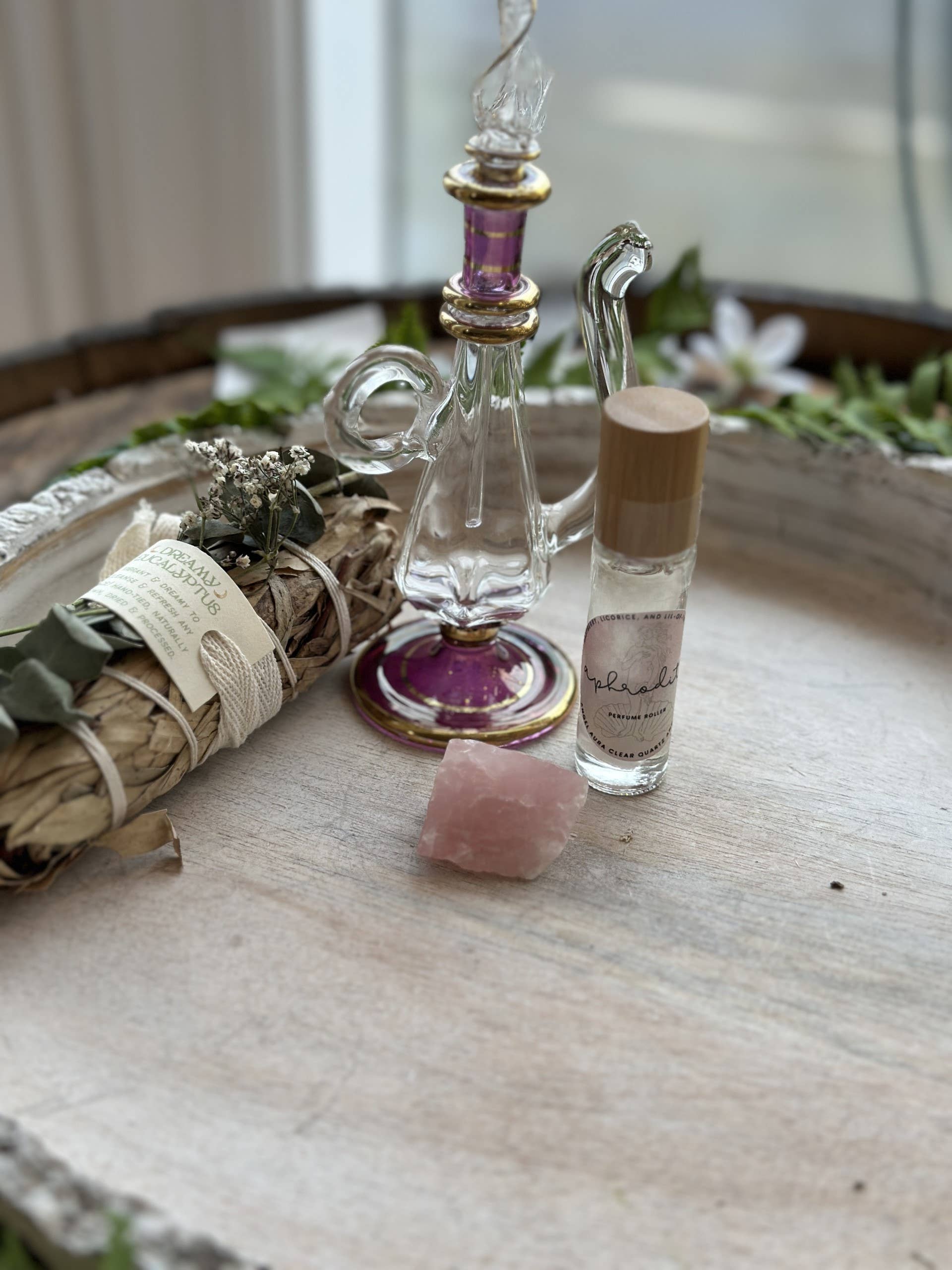 Aphrodite Goddess Perfume Roller with moonstone, rose petals &amp; coconut oil. A sweet sugar scent that inspires love, beauty &amp; divine feminine energy.